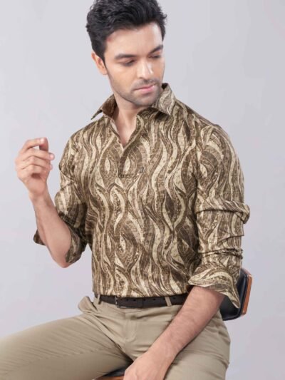 A stylish man wearing a Copper Brown Digital Printed Shirt by Chessline Clothing Company, paired with tan pants, showcasing a modern and sophisticated look perfect for casual and semi-formal occasions