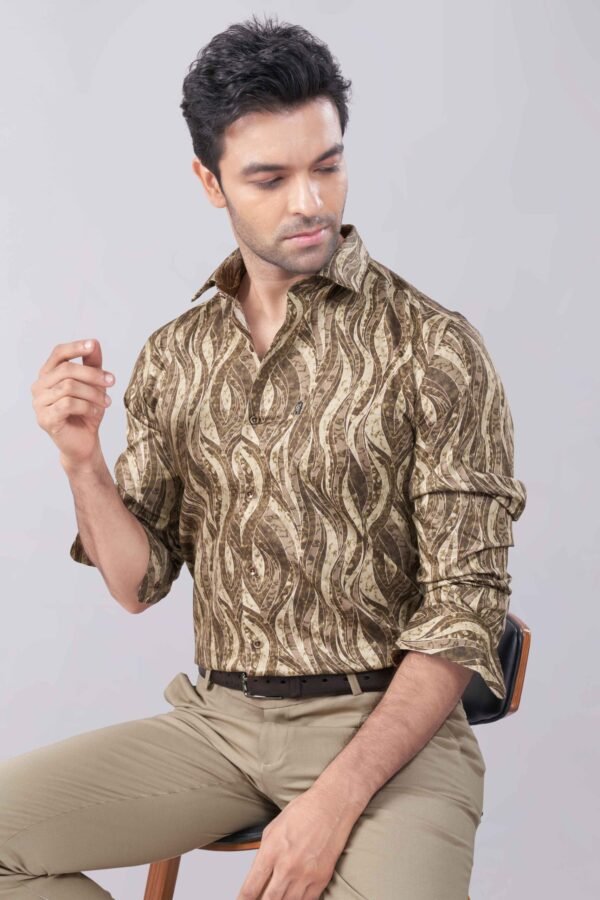 A stylish man wearing a Copper Brown Digital Printed Shirt by Chessline Clothing Company, paired with tan pants, showcasing a modern and sophisticated look perfect for casual and semi-formal occasions